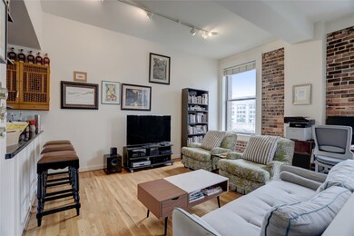 Living area with south side brick walls.  Left sid