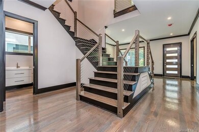 Dramatic stairwell with cable wiring.