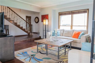 Sunken living room with newer paint and flooring