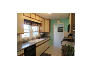 The kitchen has ceramic tile floors for easy clean