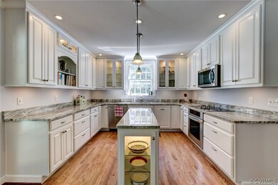 The kitchen also includes a lit island, easy open doors and drawers.