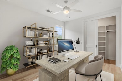 Office with light wood-style flooring and a ceili
