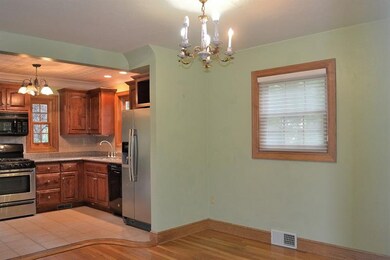 The dining room is open to the kitchen for ease in