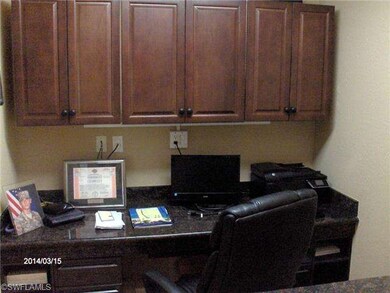 View of office from hall. Desk and cabinets built 