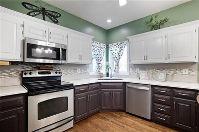 The kitchen has lots of cabinet space as well as c
