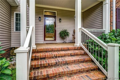 Beautiful entry with friendly bricked steps to por