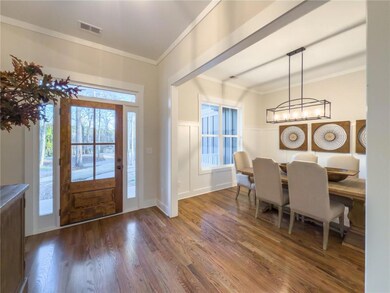 Entrance foyer featuring dark wood-type flooring a