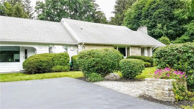 Front showing driveway and path.