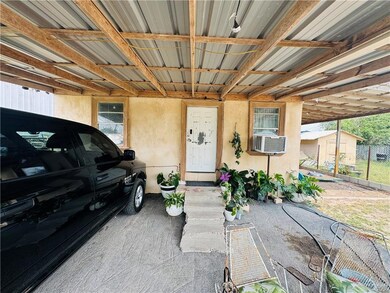 Property entrance featuring a carport