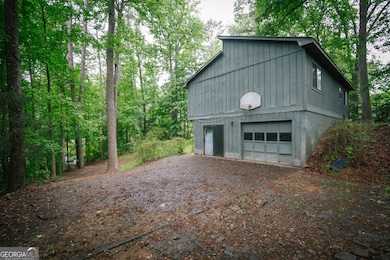 A view of the side of the house with access from the garage or sliding glass doors.