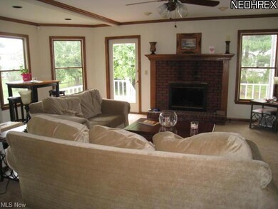 Great room has crown molding and lots of natural light.