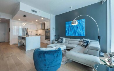 Living area with light wood-type flooring and rec
