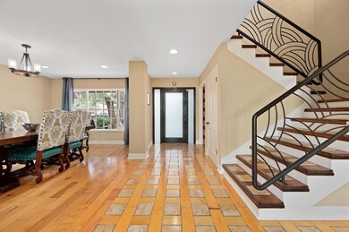 Foyer with recessed lighting, light wood-style fl