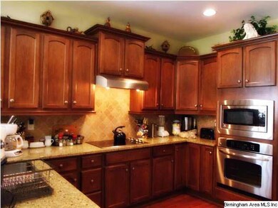 Love to cook? This kitchen has stainless appliance