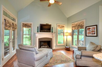 KEEPING ROOM FEATURING GAS FIREPLACE OPENS TO THE KITCHEN