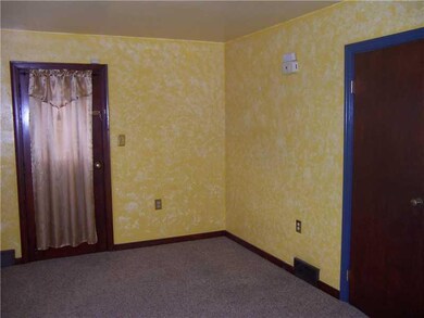 Living Room. You can access the covered side porch
