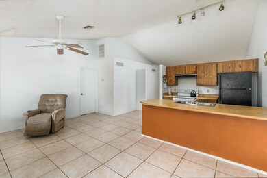 6) FAMILY ROOM - KITCHEN