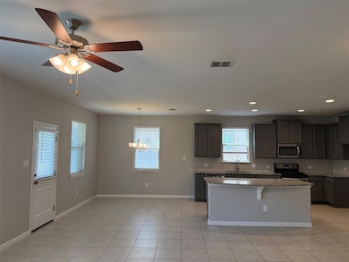Kitchen featuring appliances with stainless steel