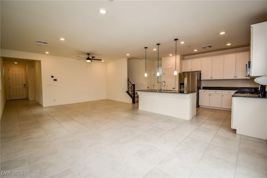 Kitchen with dark countertops, open floor plan, ce