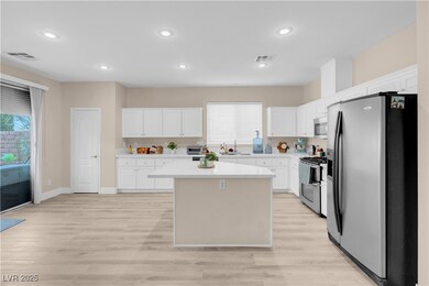 Kitchen with visible vents, light countertops, a s