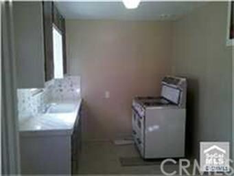 Nice kitchen with a standing gas stove.