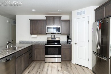 Kitchen with sink, appliances with stainless steel
