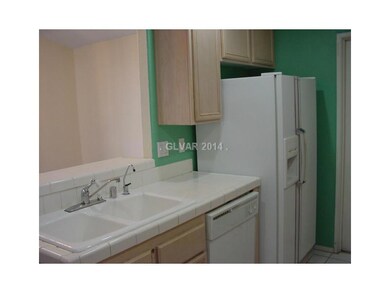 Property Photo. Kitchen Fridge/Sink