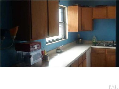 Kitchen overlooks the backyard