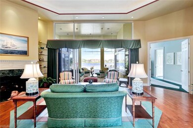 Living room with crown molding and wood-type floor