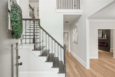Stairway featuring wood finished floors, ornamenta