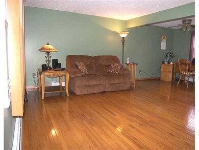 Living Room Gleaming hardwood floors add a real to