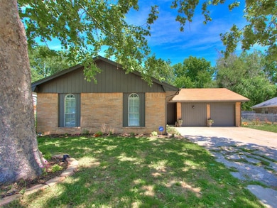 Ranch-style house featuring an attached garage, br