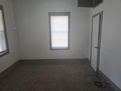 Carpeted spare room with a healthy amount of sunli