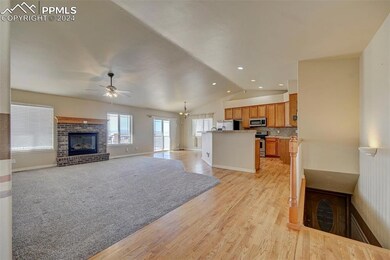 Unfurnished living room with ceiling fan with nota