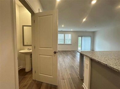 Living room with half bath displayed