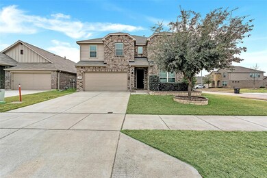 View of front of home featuring a garage and a fro