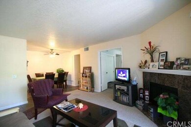 Living Room with Granite Accented Fire Place.