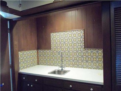 The wet bar area could also be converted into a ma