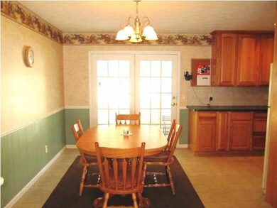 Dining area is spacious and offers French doors to
