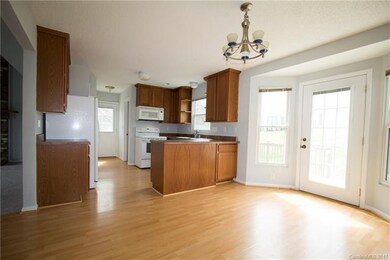 Spacious eat-in kitchen area.  Powder room behind 