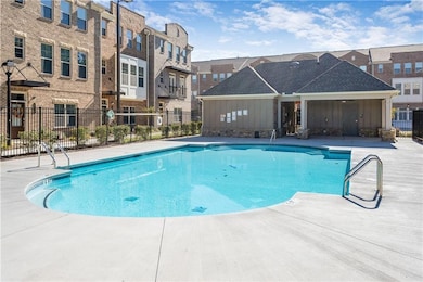 Community pool featuring fence, a residential view