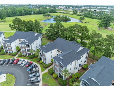 Bird's eye view of a nearby body of water and a golf course