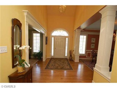 Foyer - Striking 2-story foyer with gleaming hardw