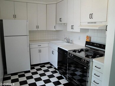 Kitchen - lots of cabinets and new refrigerator in