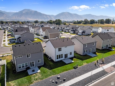 Aerial view of residential area featuring a mountainous background