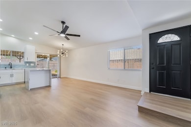 Foyer entrance with a chandelier, vaulted ceiling,