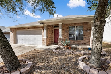 Single story home featuring brick siding, an atta