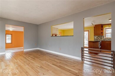Living Room with wood floors and a doggie gate.  T