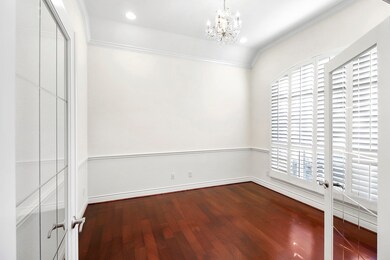 Home Office has relaxing front yard views. Notice the crown molding throughout the Home and the custom made Plantation Window Shutters. NO carpet 12 Foot ceilings!