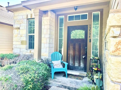 View of exterior entry with stone siding